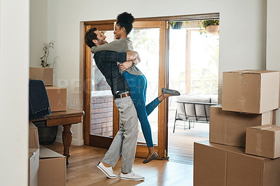 Buy stock photo Happy couple celebrating a new home with a husband lifting his wife in excited, romantic and in love celebration together. Smiling, loving and carefree man and woman in a modern real estate property