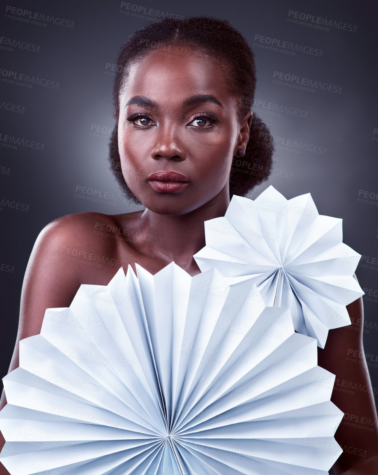 Buy stock photo Black woman, portrait and origami fans in studio, cosmetics and oriental beauty on dark background. Female person, skin treatment and confidence for glow, serious and foundation shine for dermatology