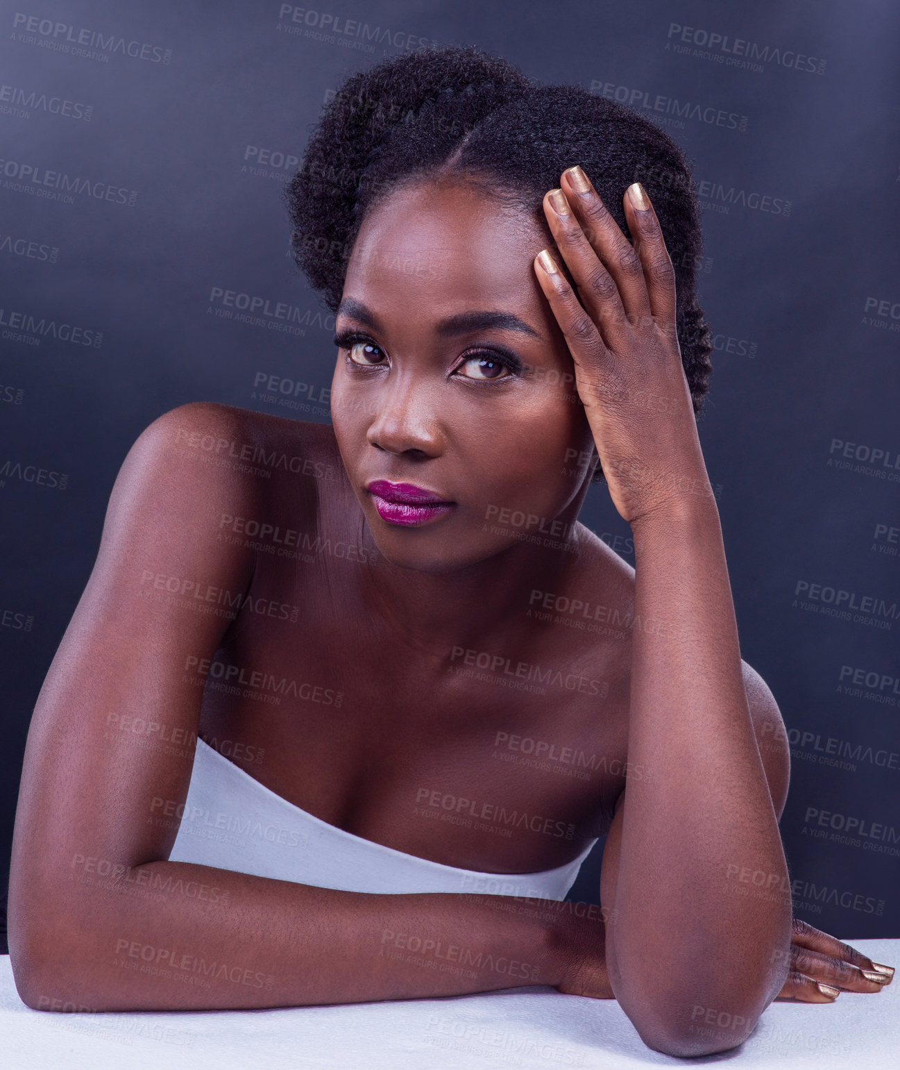 Buy stock photo Studio portrait of a beautiful young woman posing against a black background