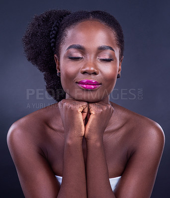 Buy stock photo Calm black woman, makeup or face for beauty, skincare, natural cosmetics or healthy shine isolated in studio. Eyes closed, girl or proud African model with glow, smile or results on dark background 