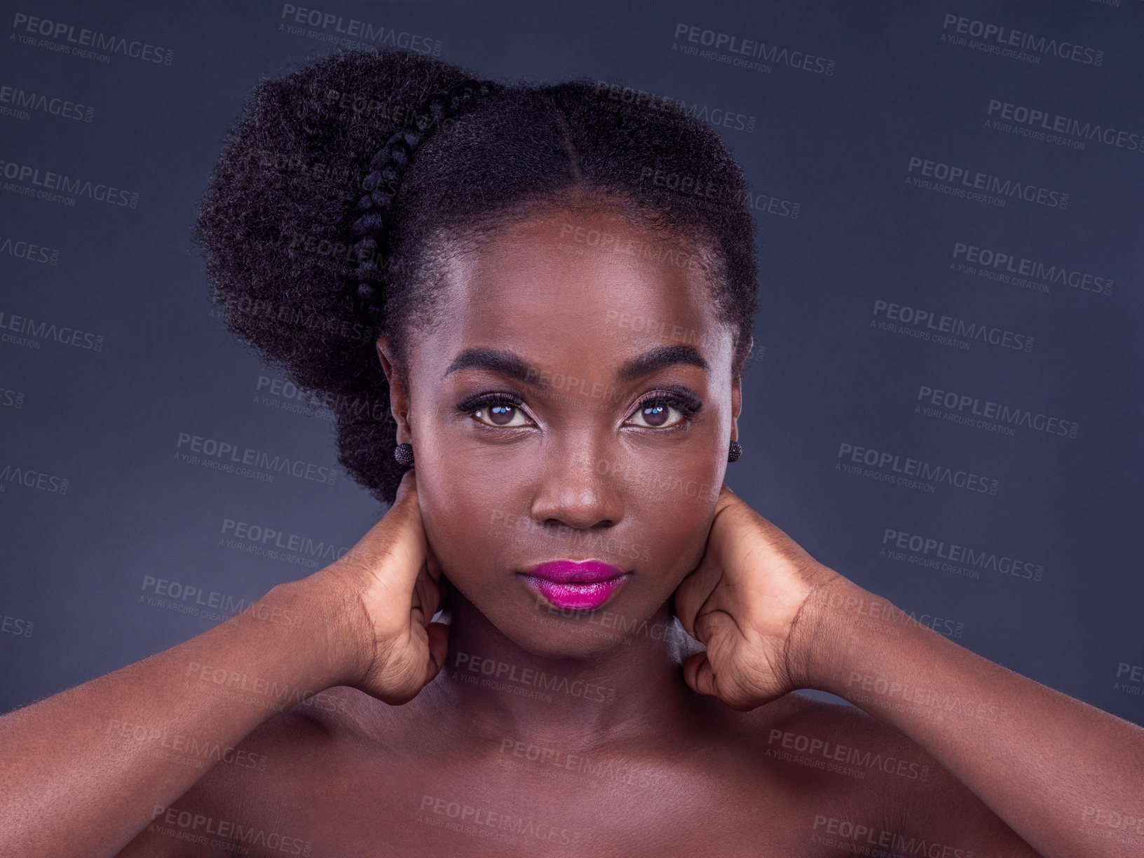 Buy stock photo Studio portrait of a beautiful young woman posing against a black background