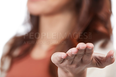 Buy stock photo Shot of an unidentifiable young woman holding up a toy animal in studio