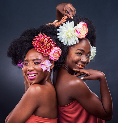 Buy stock photo African, beauty and friends with flowers in makeup and art on dark background, studio and mockup. Floral, cosmetics and creative black women in portrait with natural or sustainable skincare in spring