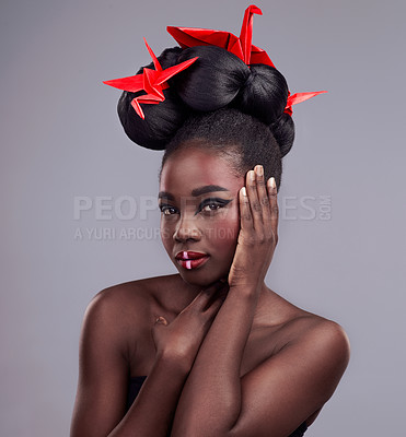 Buy stock photo Black woman, studio and portrait with origami for beauty, traditional or creative with cosmetics. Female model, gray background and oriental paper design with makeup or color for culture and art