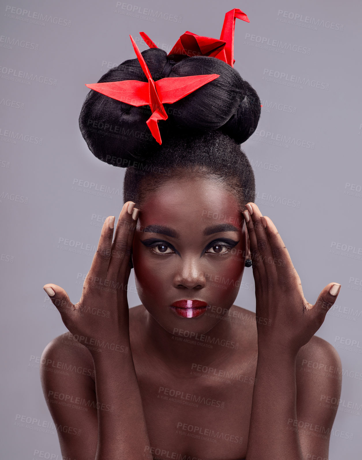 Buy stock photo Portrait, black woman and origami bird in studio isolated on gray background with makeup for aesthetic. Cosmetics, symbolism and glow with beauty, skincare and tradition with cultural expression