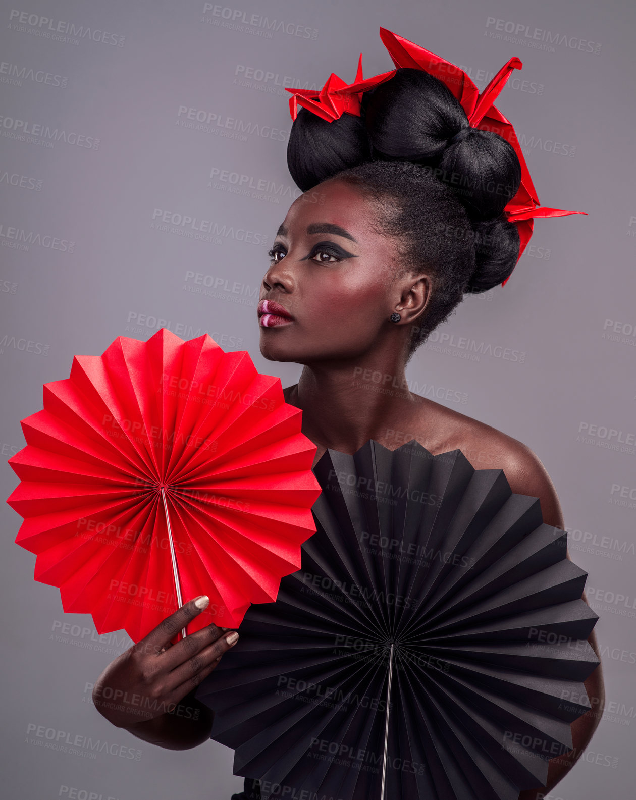 Buy stock photo Cosmetics, makeup and origami with black woman in studio for creative, art and culture. Traditional, beauty and paper design with female model and fans on grey background for asian, retro or color