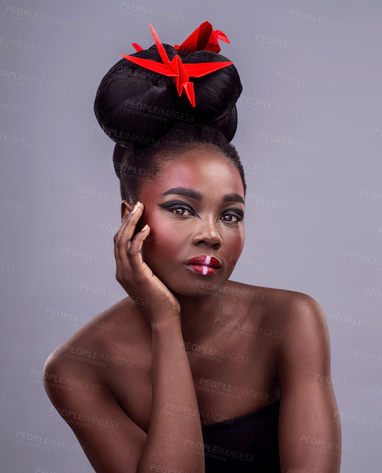 Buy stock photo Black woman, studio and portrait with origami for beauty, traditional or creative with cosmetics. Female model, gray background and paper design with makeup or color for art, culture and hair