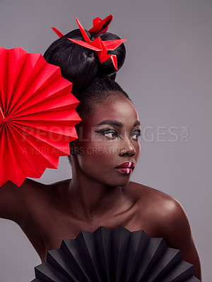 Buy stock photo Beauty, makeup and origami with black woman in studio for creative, art and culture. Traditional, cosmetics and paper design with female model and fans on grey background for oriental, retro or color