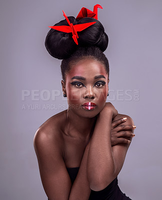 Buy stock photo Female model, studio and portrait with oriental origami for beauty, traditional or creative cosmetics. Black woman, gray background and paper design with makeup or color for art, culture or craft