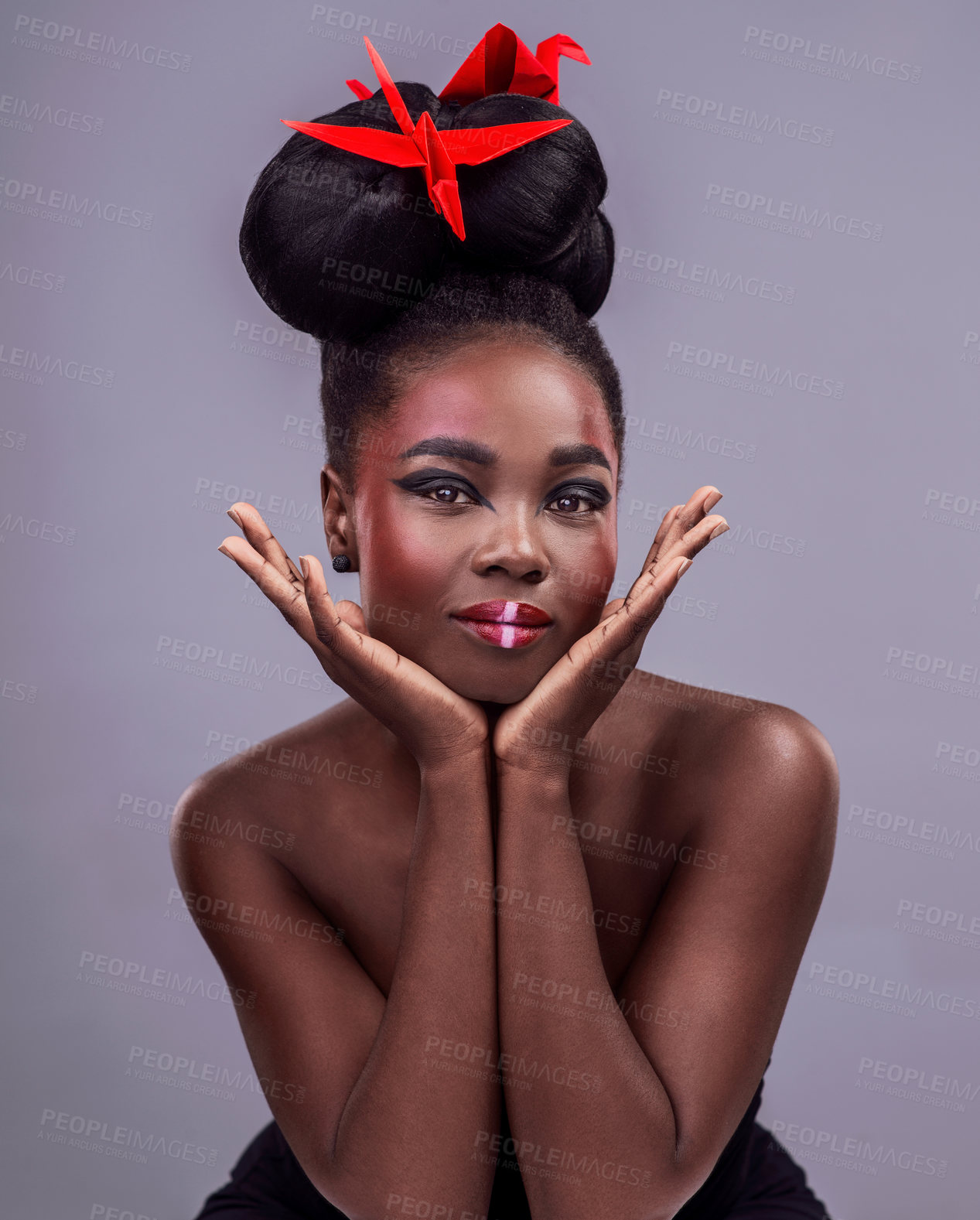 Buy stock photo Black woman, portrait and origami bird in studio isolated on gray background with makeup for aesthetic. Cosmetics, smile and natural beauty, symbolism and visual storytelling with expression or pride