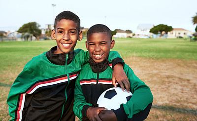 Buy stock photo Portrait of two young boys playing soccer on a sports field