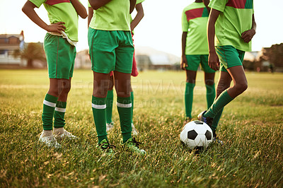 Buy stock photo Closeup shot of a group of young boys playing soccer on a sports field
