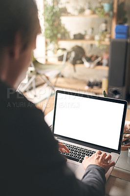 Buy stock photo Cropped shot of an unrecognisable man using a laptop at home