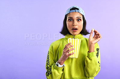 Buy stock photo Shocked, wow and woman with popcorn for a movie or streaming service or cinema and in studio against a purple background. Video, entertainment and film or television or omg and box snack on mock up