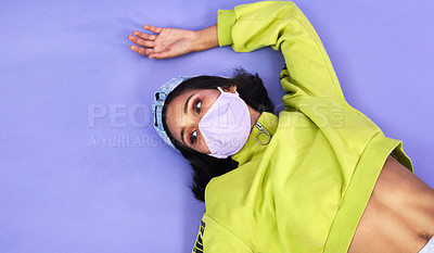 Buy stock photo Woman, face mask and safety in studio for danger, allergy and virus with retro fashion. Gen z, social distancing and memory on floor for outfit, style and mockup space for risk by purple background