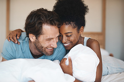 Buy stock photo Happy couple, bed and hug laughing in relax for morning, bonding or relationship at home. Interracial man and woman smiling, hugging and laugh in happiness or relaxing weekend together in bedroom