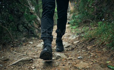 Buy stock photo Closeup shot of an unrecognisable man hiking through the mountains