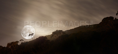 Buy stock photo Landscape view of smoke from uncontrollable wildfire or bush fires rolling over Table Mountain Nature Reserve, South Africa. Fog, mist and moon over remote countryside hill with copy space at night