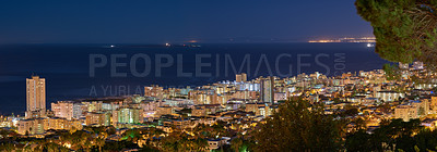 Buy stock photo Copy space with dark night sky over the view of a coastal city seen from Signal Hill in Cape Town, South Africa. Calm and scenic panoramic landscape of lights illuminating an urban skyline by the sea