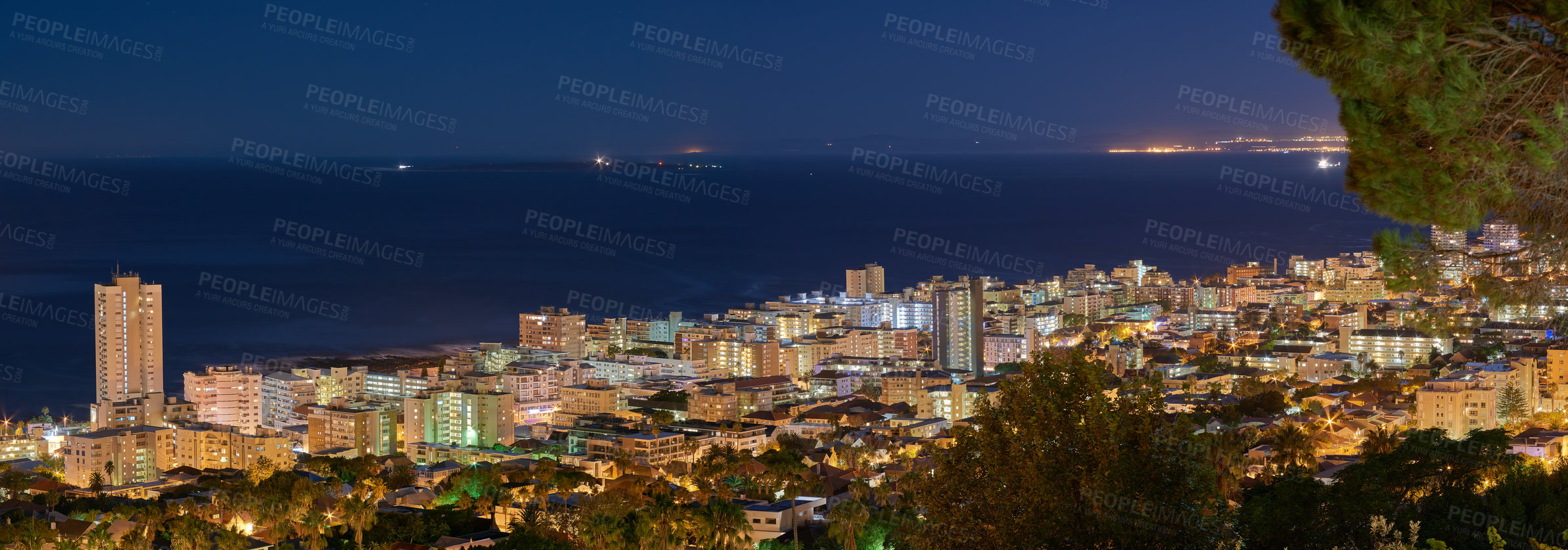 Buy stock photo Copy space with dark night sky over the view of a coastal city seen from Signal Hill in Cape Town, South Africa. Calm and scenic panoramic landscape of lights illuminating an urban skyline by the sea