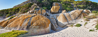 Buy stock photo Boulders on the rocky coast of Western Cape, South Africa, Landscape view of a beautiful beach and seashore in Cape Town. The natural seaside environment in a popular tourist location for a holiday