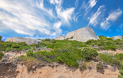 Buy stock photo Landscape view of Table Mountain in Cape Town, South Africa from below. Scenery of a popular tourist attraction during the day against a cloudy blue sky. Natural terrain for travel and hiking