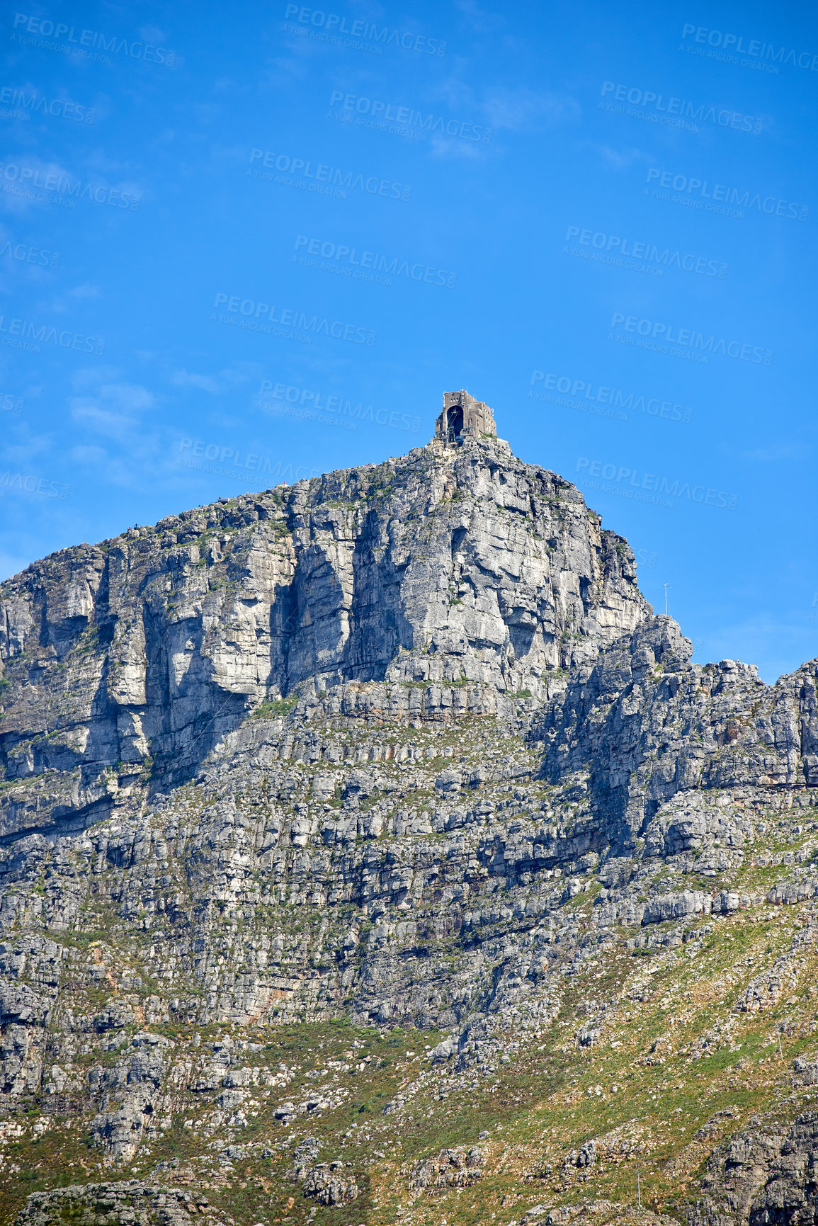 Buy stock photo Copy space with landscape of Table Mountain in Cape Town with a cable car station at the peak against a blue sky background. Beautiful scenic views around an iconic travel destination and landmark