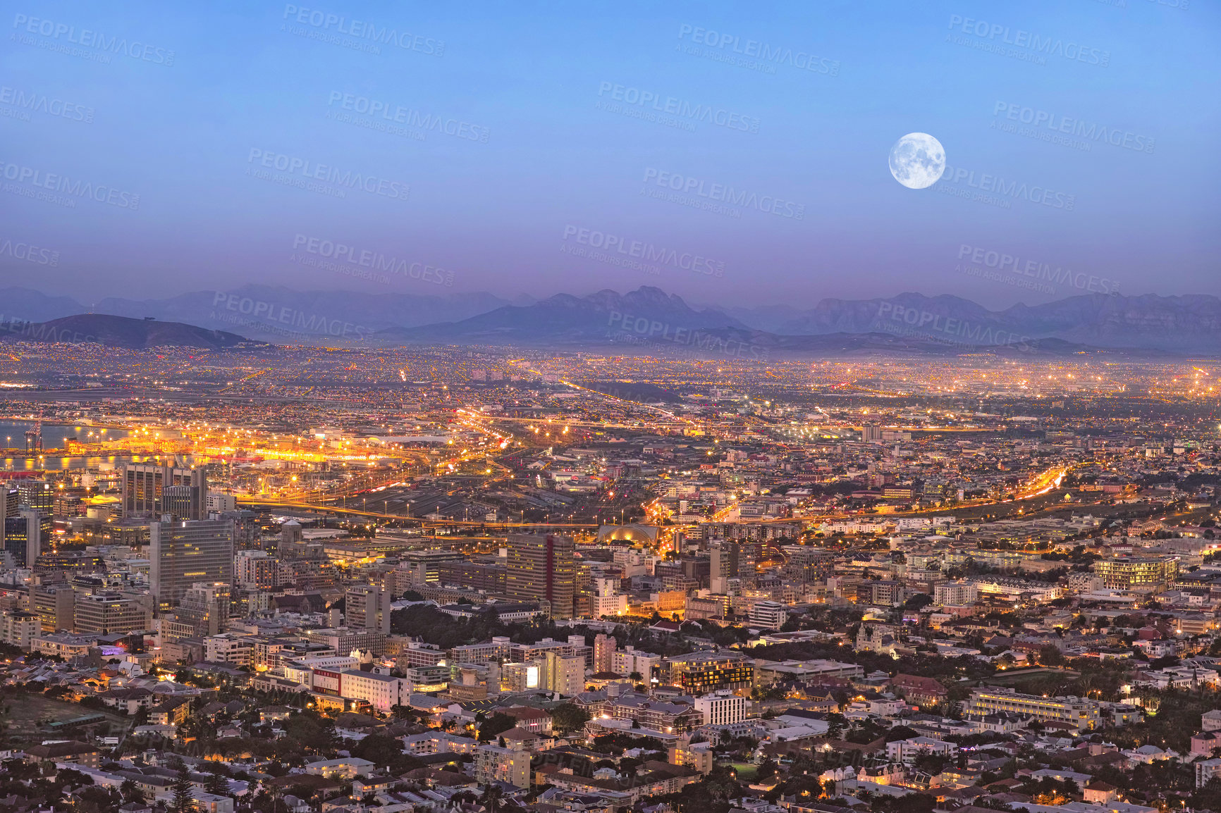 Buy stock photo Copy space night view of city buildings with electricity lights, infrastructure and moon with mountain background in travel destination. Cape Town, South Africa downtown centre and urban architecture