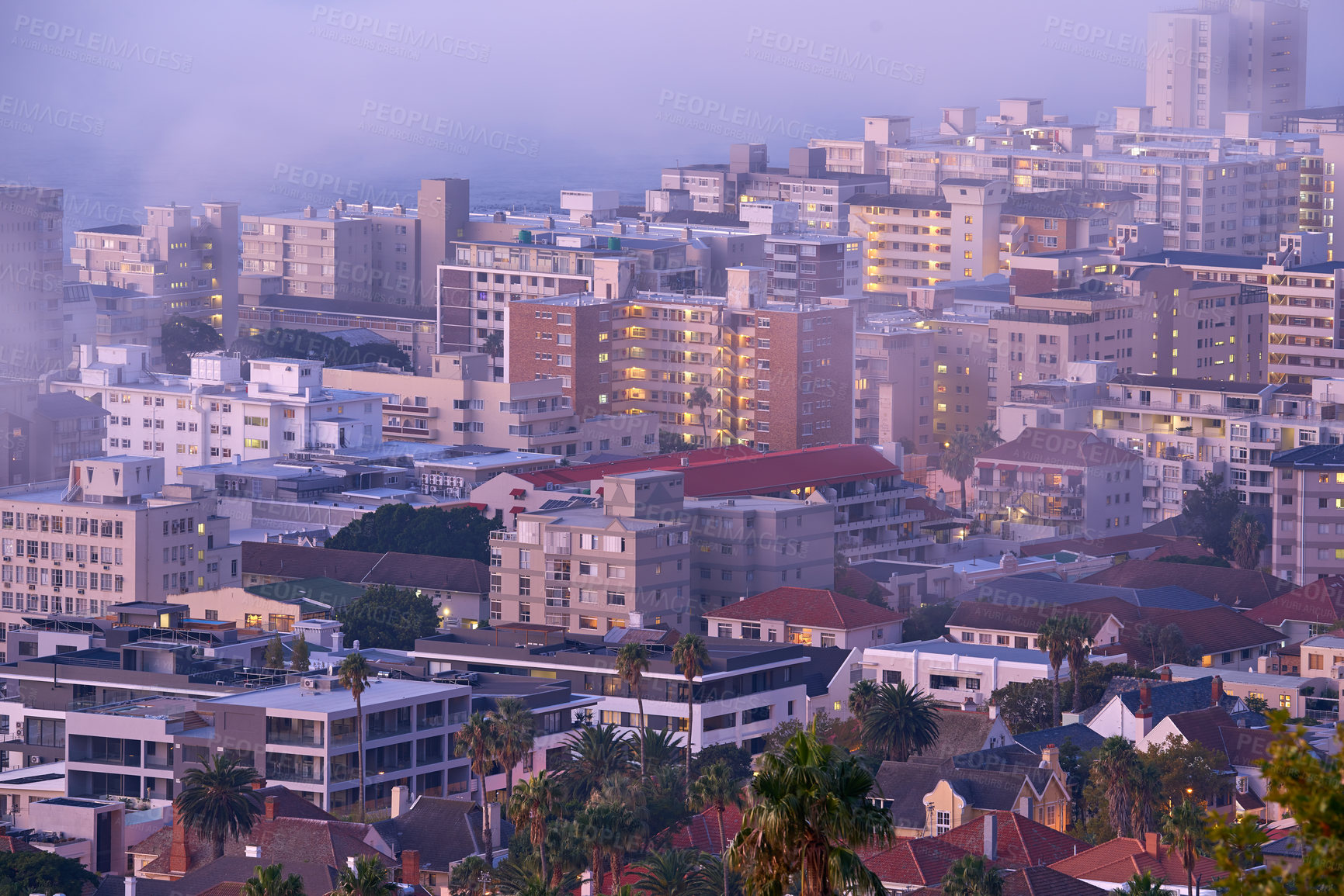 Buy stock photo Drone point of view of fog or mist over city buildings and downtown infrastructure in the early morning. Aerial of cold weather front, wildfire or bush fire smoke rolling into town in South Africa