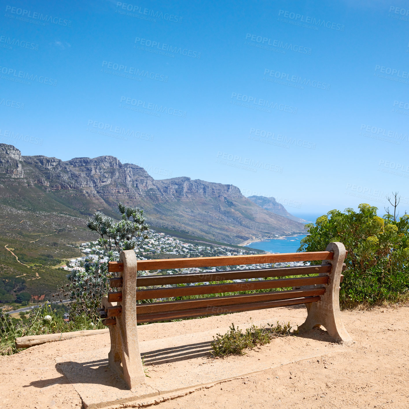 Buy stock photo Bench with a beautiful view of the mountain and sea against a clear blue sky background with copy space. Landscape of relaxing outdoor seating on cliff to enjoy zen moment in Cape Town, South Africa