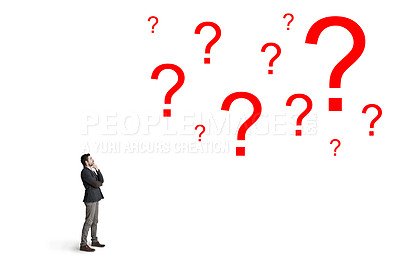 Buy stock photo Shot of a businessman looking up at question marks against a white background