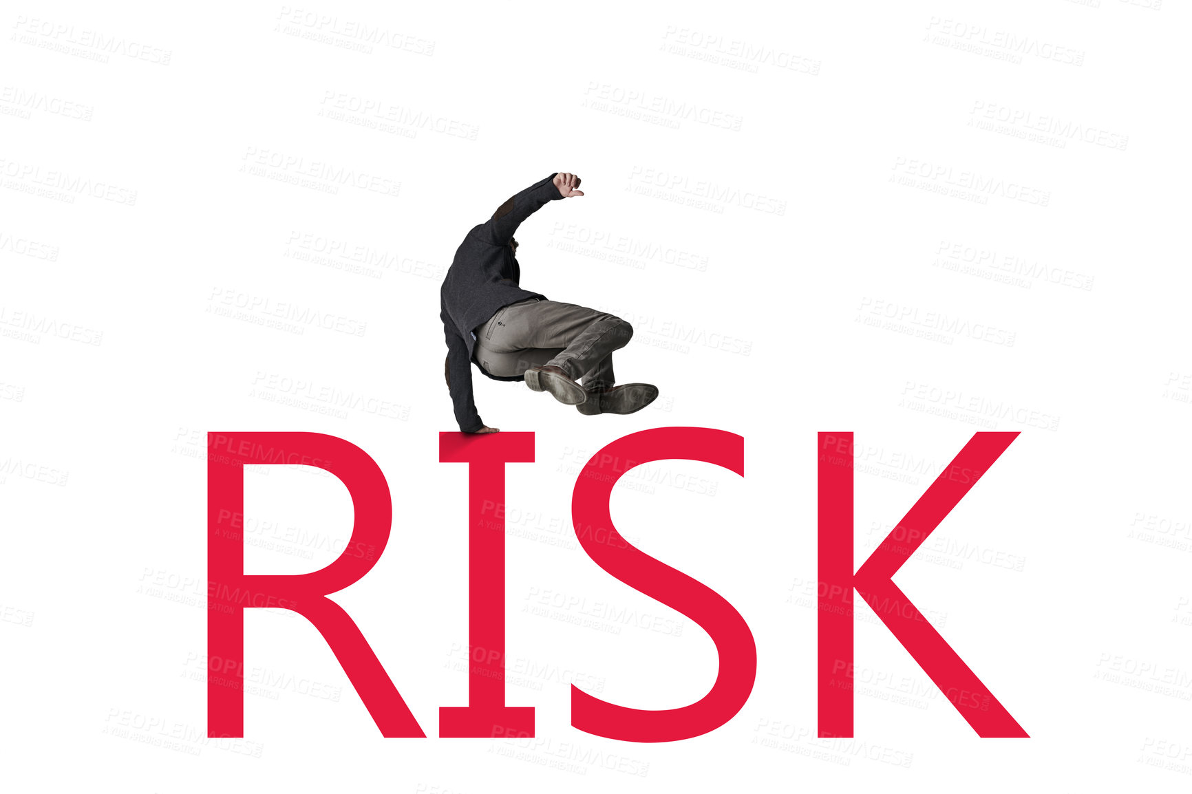 Buy stock photo Shot of a businessman jumping over the word ‘RISK’ against a white background