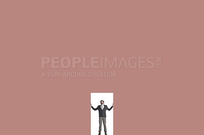 Buy stock photo Shot of a businessman caged in against a coloured background