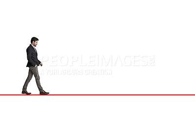Buy stock photo Shot of a businessman walking along a straight line against a white background