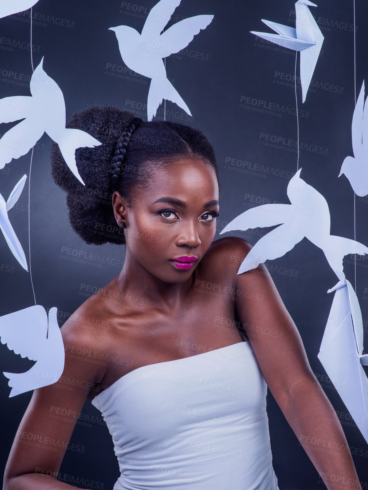 Buy stock photo African woman, symbolism and traditional beauty with paper birds for art, fashion and confidence. Black girl, creative and social expression with origami for portrait, design and cultural diversity