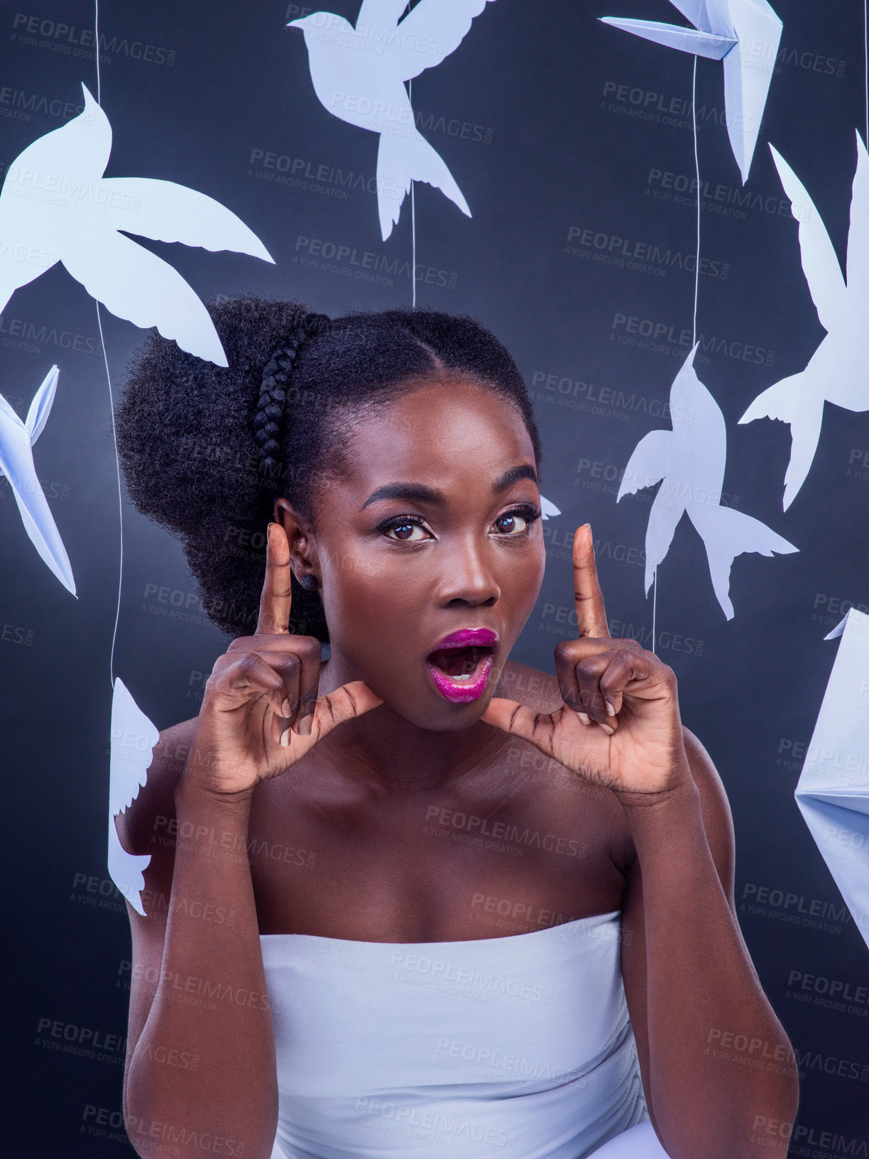 Buy stock photo Portrait, black woman and paper birds in studio with shocked expression or hands to gesture frame for creative origami. Surprise, female person and surreal for fantasy art from on dark background
