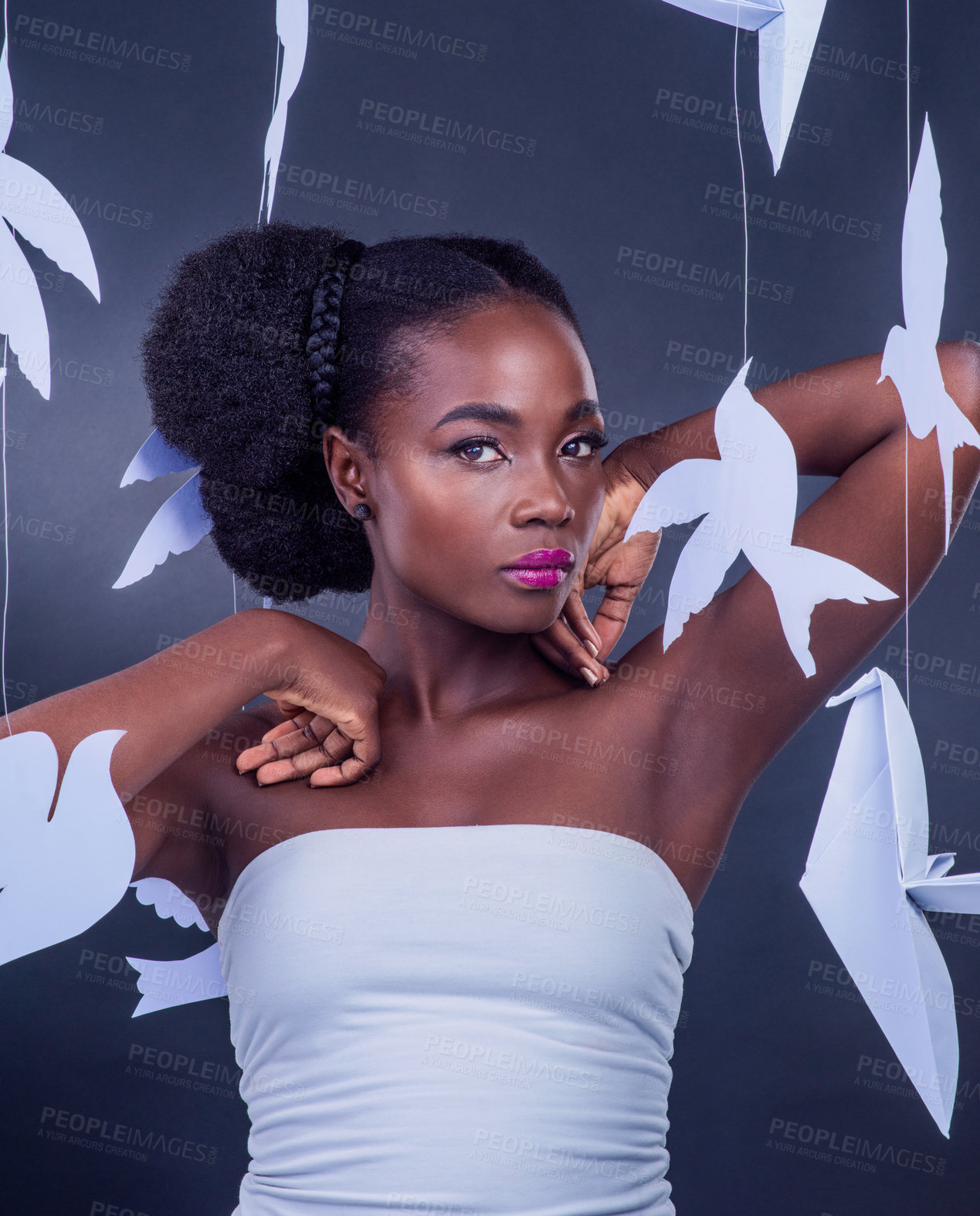 Buy stock photo Black woman, diversity and origami for beauty, symbolism and cultural expression with portrait. African model, creative and fashion with paper birds for art, confidence or empowerment in studio