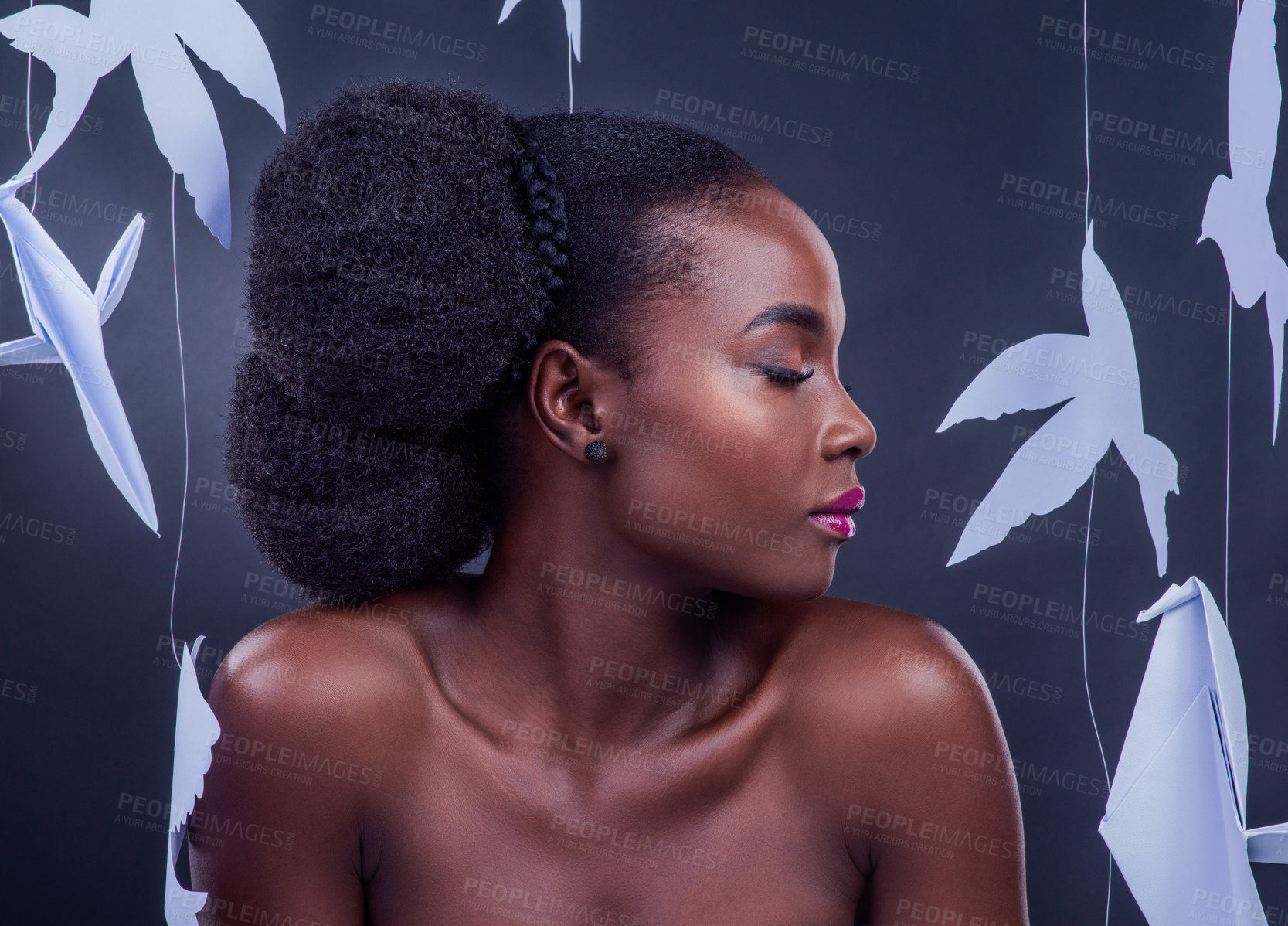 Buy stock photo Black model, paper bird and beauty for freedom, peace and wellness isolated in dark background. African woman, cosmetics and abstract fantasy with makeup, skincare and creative animal art or origami