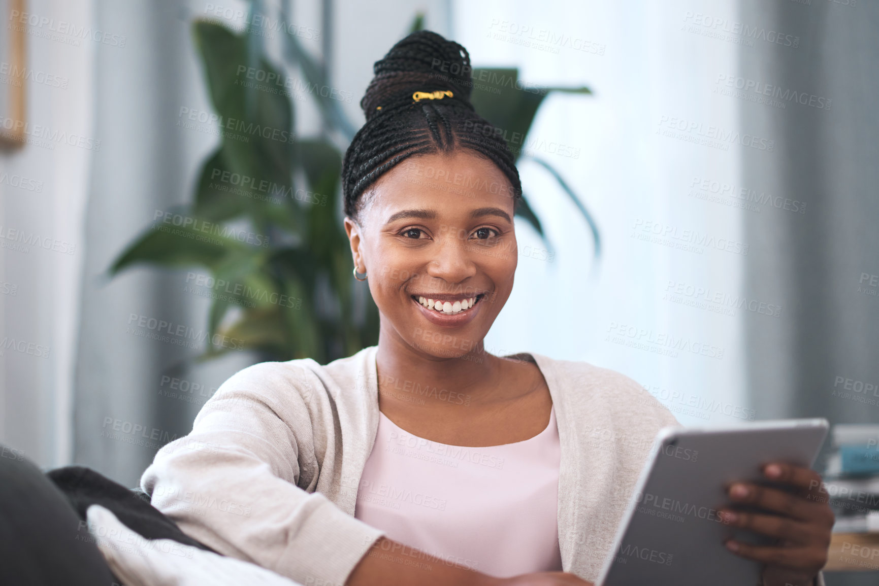 Buy stock photo Black woman, tablet and portrait smile on sofa for social media, communication or entertainment at home. Happy African American female smiling and relaxing holding touchscreen for remote networking