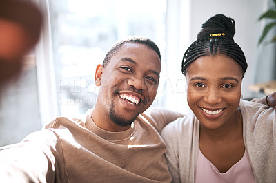 Buy stock photo Portrait and couple taking selfie with loving, bonding care romantic relationship at home. Loving, caring african american husband and wife or spouse taking face photo while relaxing together