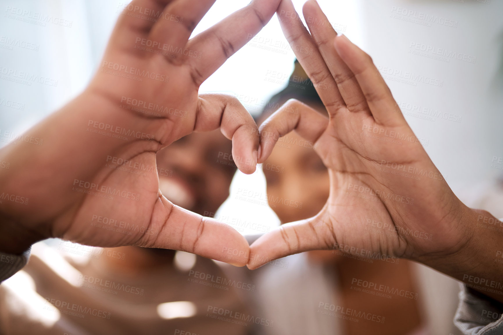 Buy stock photo Love, heart hands and happy black couple excited for future in new home with support, trust and commitment. Romance, heart hands with black man and black woman relax on honeymoon together.