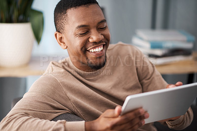 Buy stock photo Black man, tablet and happiness of a person on a living room sofa with technology online. Social media content, video streaming or meme of a man smile on a house couch on wifi and web at home