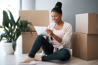 Buy stock photo Black woman, moving and new house with tablet for online shopping or ecommerce for interior decorating with cardboard box on floor. Happy new home owner with technology for bank loan for renovation