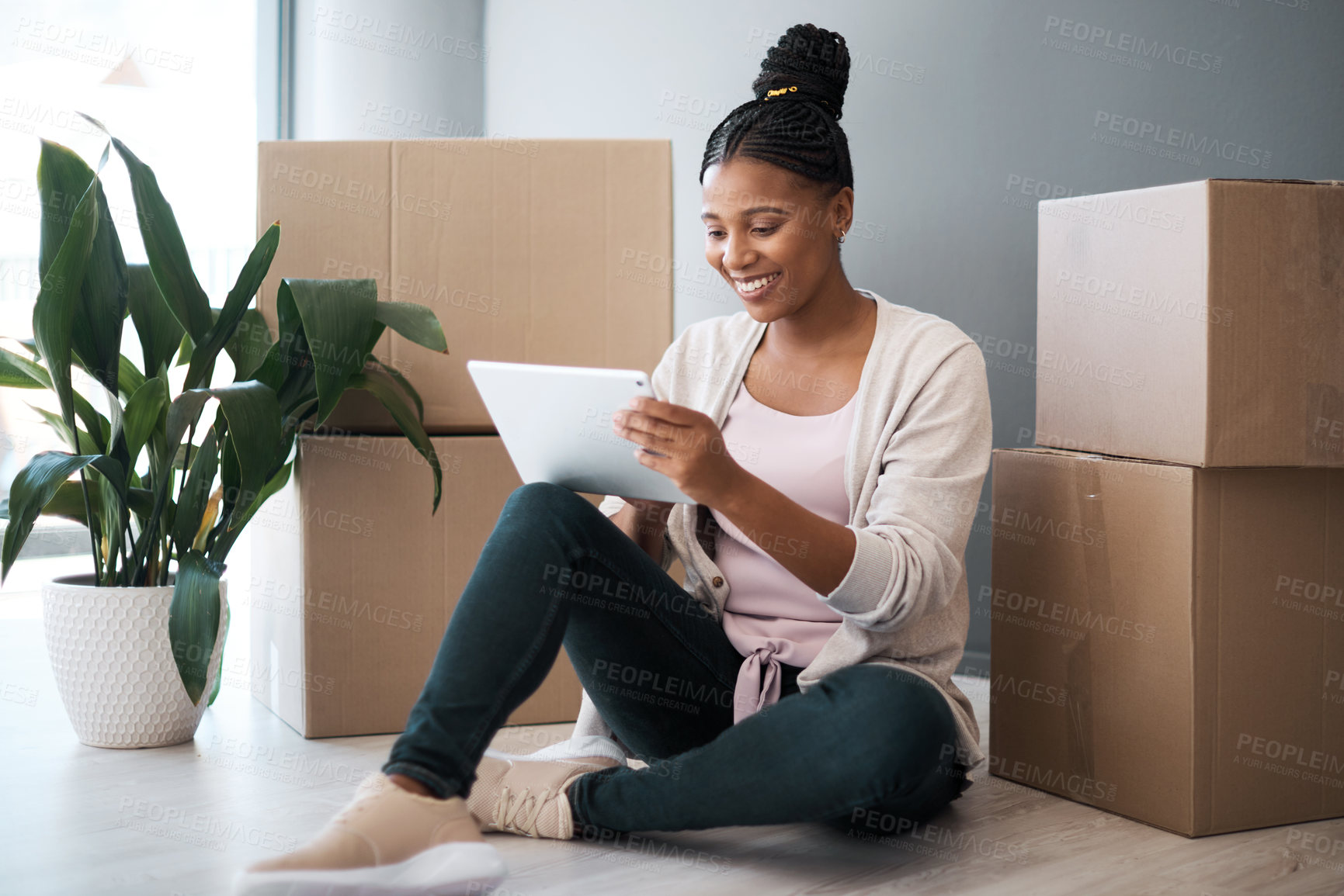 Buy stock photo Black woman, moving and new house with tablet for online shopping or ecommerce for interior decorating with cardboard box on floor. Happy new home owner with technology for bank loan for renovation