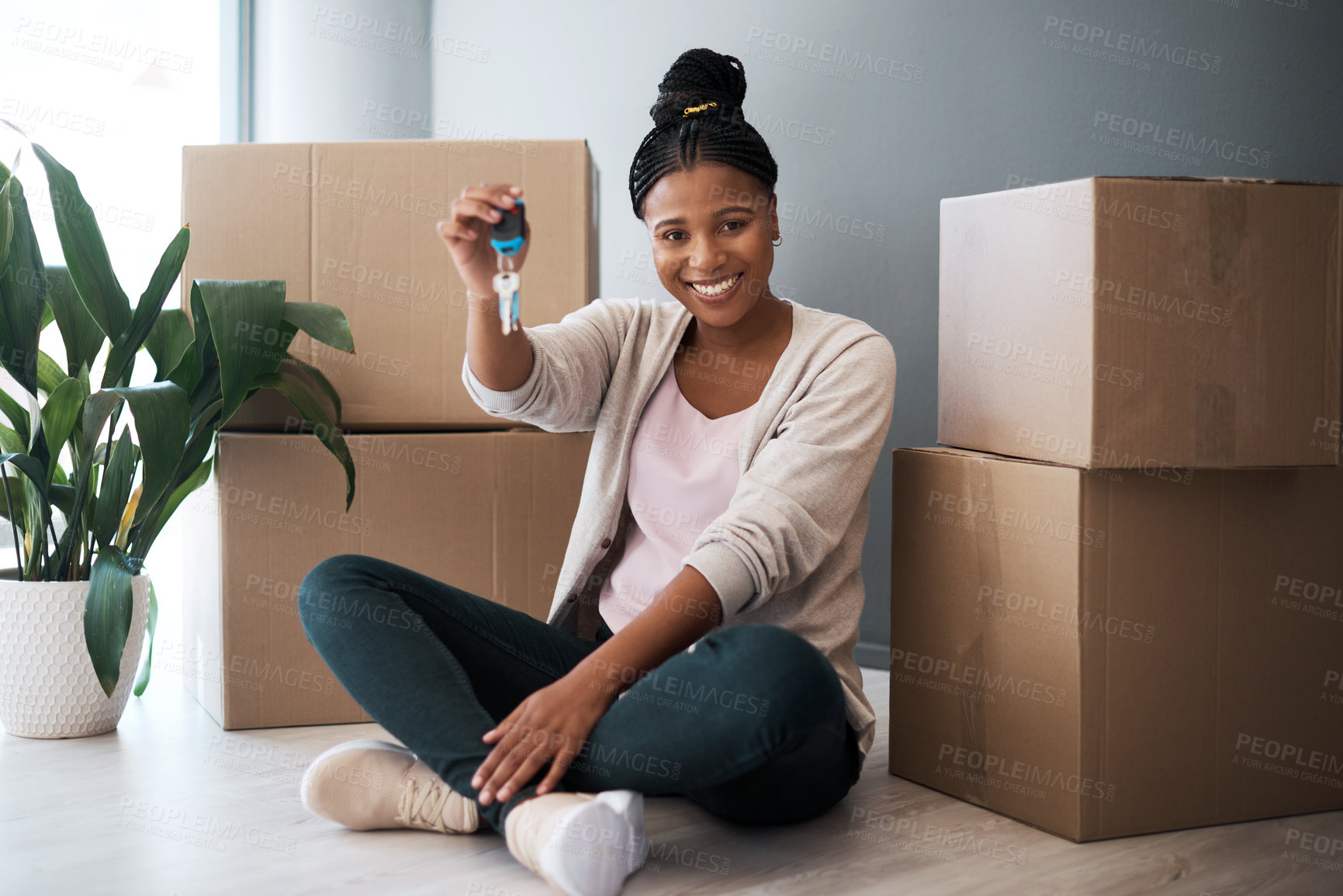 Buy stock photo Boxes, black woman and homeowner with keys, to new home and happiness in home. Property, African American female and lady moving into house, happy and content with apartment, excited and portrait.