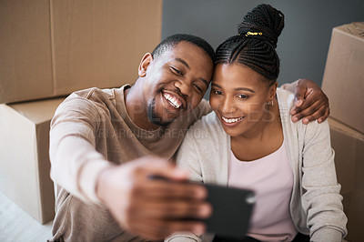 Buy stock photo Phone, couple and selfie while moving in to home, real estate or apartment, happy and proud on a floor. New house, property and man with woman on a living floor for picture, moment and bonding