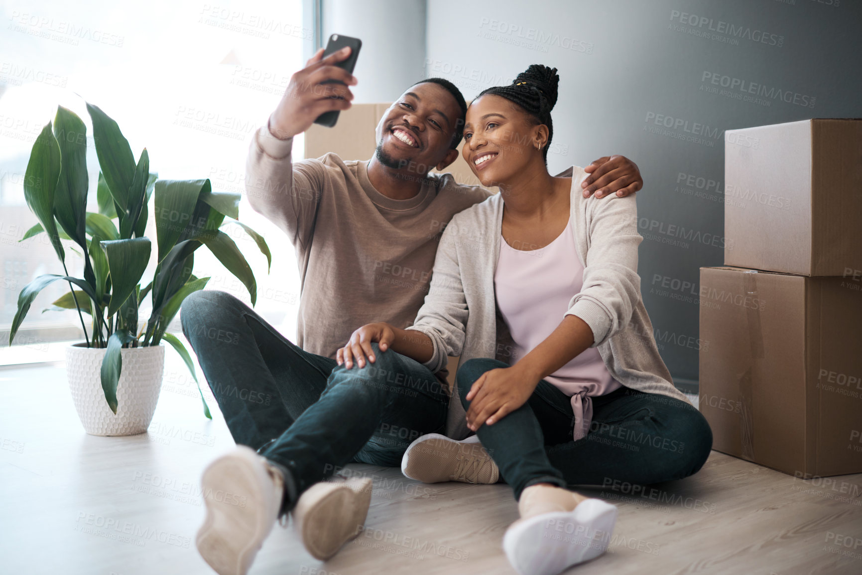 Buy stock photo Black couple, phone and smile for selfie, moving in or real estate, property or new home together. Happy African American man and woman smiling in happiness or satisfaction for photo and buying house