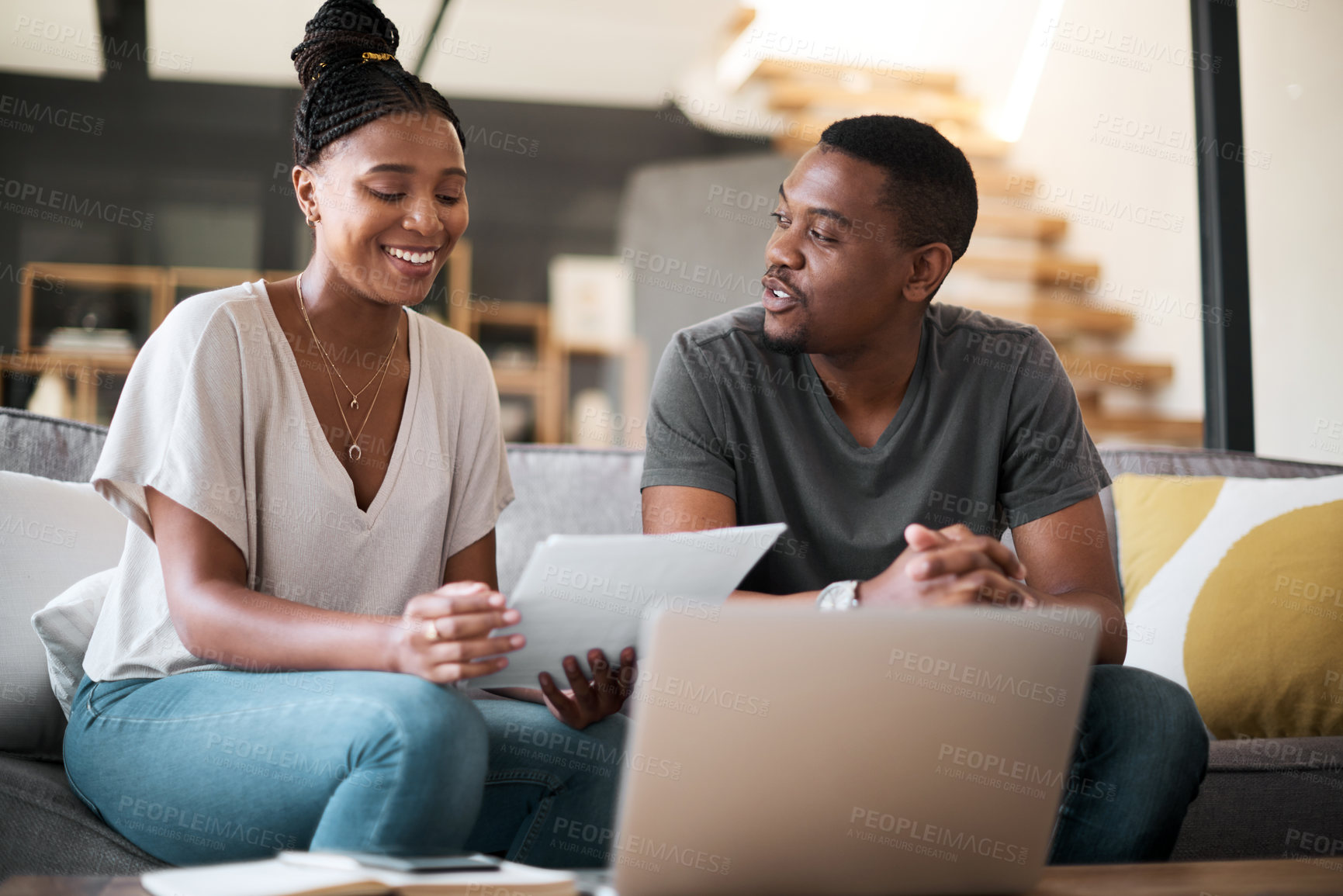 Buy stock photo Laptop, finance and budget with a black couple working on debt or accounting or banking in their home living room. Computer, documents and investment with a man and woman financial planning online