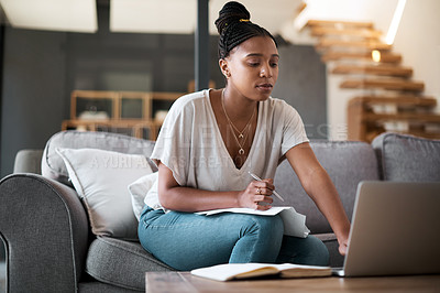 Buy stock photo Finance, laptop and black woman writing a house budget for bills, savings or money management on living room sofa. Paperwork, inflation and African person planning financial taxes payment in notebook