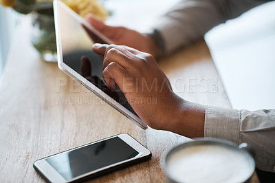 Buy stock photo Hands, tablet and research with a business black man working at a desk in a coffee shop closeup from above. Marketing, social media and data with a male employee doing a search on the internet